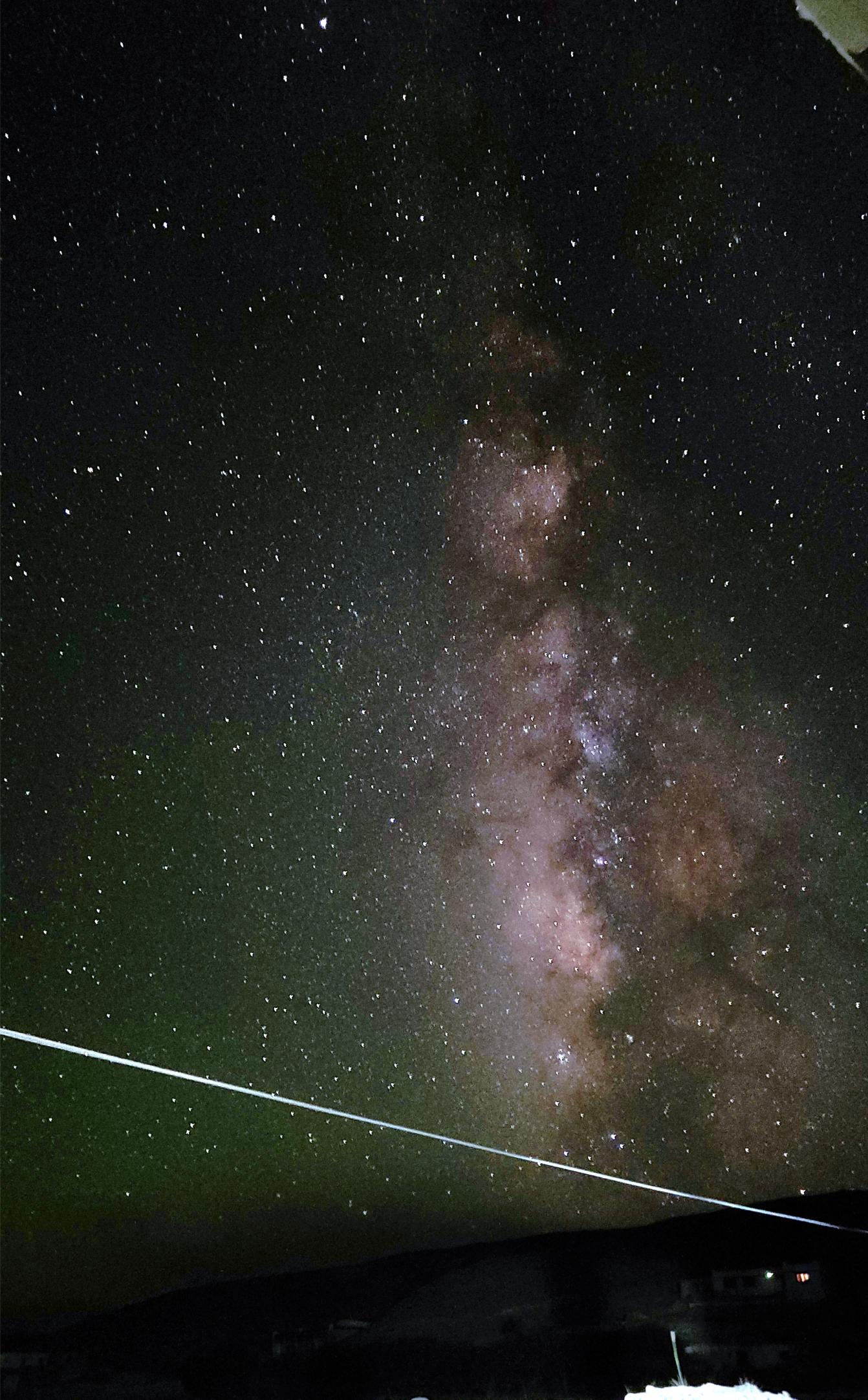 A starry sky above a road.